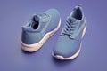 pair of comfortable blue sport shoes on blue background, shoe store Royalty Free Stock Photo