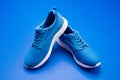 pair of comfortable sport shoes. sporty blue sneakers. shoes on blue background. Royalty Free Stock Photo