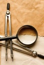 Pair of compasses and magnifying glas Royalty Free Stock Photo