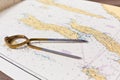 Pair of compasses for navigation on a sea map Royalty Free Stock Photo