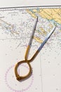 Pair of compasses for navigation on a sea map Royalty Free Stock Photo