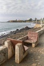 A pair of concrete seats which have fallen into disrepair on the wall of the Sao Tome Promenade. Royalty Free Stock Photo