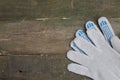 Work gloves on an old wooden table Royalty Free Stock Photo