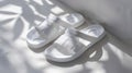 A pair of creative EVA slippers, EVA material, high-grade white background, dappled sunlight