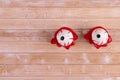 Pair of creepy bloodshot eyes isolated on wooden background