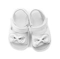 Pair of cute baby sandals decorated with bows