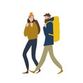 Pair of cute backpackers walking together. Boyfriend and girlfriend hiking or backpacking in nature. Male and female