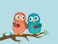 A pair of cute owlet sittinA pair of cute owlet sitting on branch Royalty Free Stock Photo