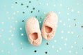 Pair of cute pink foot slippers with glitter stars