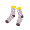 Pair of cute stylish dotted socks isolated on white background. Hand-knitted warm woolen apparel or accessory in Hygge