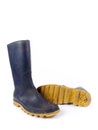 Pair of dark blue dirty rubber boots Royalty Free Stock Photo