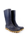 Pair of dark blue dirty rubber boots Royalty Free Stock Photo