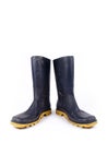Pair of dark blue dirty rubber boots Royalty Free Stock Photo