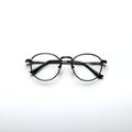 AI Generated Image Dark-Framed Eyeglasses on White Surface Royalty Free Stock Photo