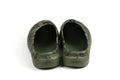 Pair dark green galoshes isolated on a white background. Shoes for rainy weather