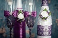 A pair of decorative purple champagne bottles and glasses for the bride and groom Royalty Free Stock Photo