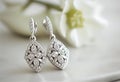 Pair of diamond and white gold earrings. Generative AI. Royalty Free Stock Photo