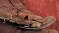 A pair of dirty shoes. Which brings back old memories. Closeup photo of torn part of old shoe