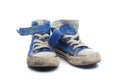 Pair of dirty, worn out blue children sneakers