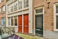 a pair of doors in front of a brick building