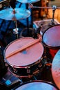 Pair of drumsticks lies on a drum kit on stage Royalty Free Stock Photo