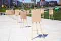 Pair of Easel with blank canvas . Blank art board and realistic wooden easel outdoors. Drawing board easel blank