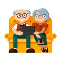 Pair of elegant elderly people are sitting on a sofa with a laptop or tablet computer. Isolated illustration on white background Royalty Free Stock Photo