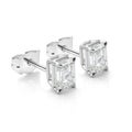 Pair of Emerald Cut Diamond Earrings on White Background Royalty Free Stock Photo