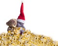 A pair of enamored New Year`s bears on a white background with tinsel and in a red hat. Place for text.