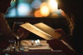 pair examining a finedining menu under soft lighting