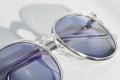 Pair of eye glasses on a white background. Correct optics against ametropia. Spectacles with chameleon and tinted lens