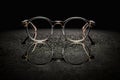 pair of eyeglasses on a black background