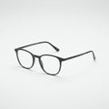 A pair of eyeglasses with black rectangular frames are centered on a plain white background Royalty Free Stock Photo