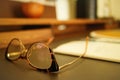 Eyeglasses and Notebook on Desk in a Quiet Study Atmosphere Royalty Free Stock Photo