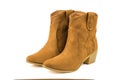 A pair of fashionable suede short boots isolated on a white background.