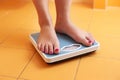 A pair of female feet on a bathroom scale Royalty Free Stock Photo