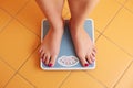 A pair of female feet on a bathroom scale Royalty Free Stock Photo