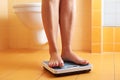 A pair of female feet on a bathroom scale Royalty Free Stock Photo