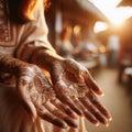 Pair of female hands that have been painted with henna tattoo patterns