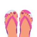 A pair of female legs with a pedicure in beach slippers. Beach shoes. Royalty Free Stock Photo