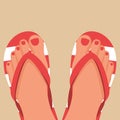 A pair of female legs with a pedicure in beach slippers. Beach shoes Royalty Free Stock Photo