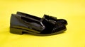 Pair of female  summer shoe on yellow background Royalty Free Stock Photo