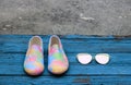 Pair of female summer shoes and sunglasses