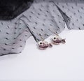 a pair of fish earings Royalty Free Stock Photo