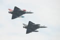 A pair of French Air Force Mirage 2000 display team fly past