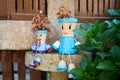 Pair of funny figurines made from painted clay pots in a garden Royalty Free Stock Photo