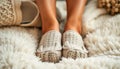 A pair of fuzzy slippers with a knitted pattern Royalty Free Stock Photo