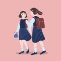 Pair of girls dressed in school uniform walking together. Female students, pupils or classmates wearing formal clothes