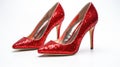 a pair of glamorous, sparkling high heel shoes, of those worn on the red carpet, against a pristine white background to