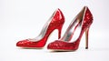 a pair of glamorous, sparkling high heel shoes, of those worn on the red carpet, against a pristine white background to